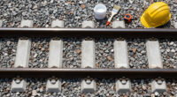 Painting The Sides Of Railroad Rails White To Reduce Derailment